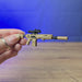 3D-printed SIG MCX Spear rifle keychain shown being held and rotated by hand, designed as a miniature rifle-inspired accessory or keyring.
