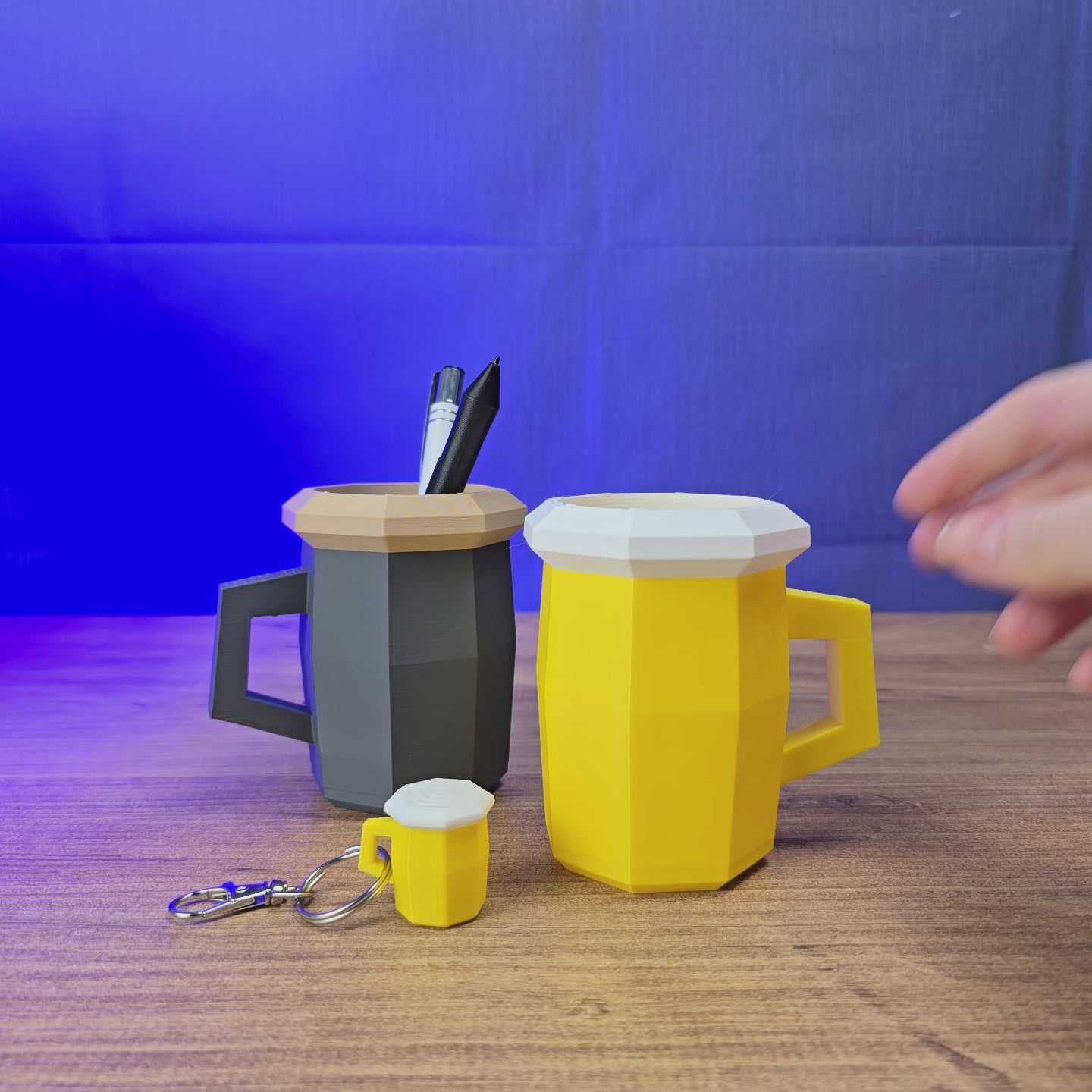 3D-printed Old School RuneScape beer or ale mug shown being held and displayed, available as a life-size desk accessory or keyring option for OSRS fans.