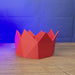 3D-printed Old School RuneScape party hat shown being held and rotated by hand, designed as a game-inspired display piece or collectible for OSRS fans.