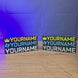 Custom Escape from Tarkov-style nameplate shown being held and displayed, featuring personalised lettering for gaming desks, shelves, or display setups.