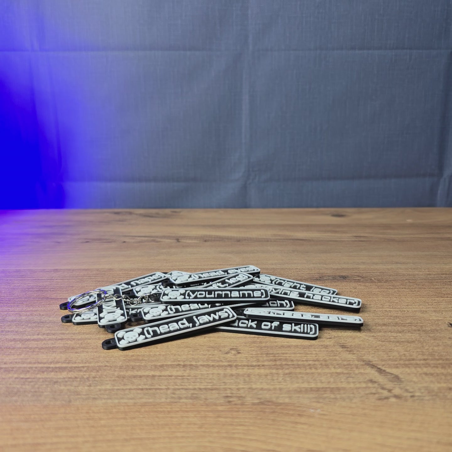 Custom Escape from Tarkov death keyrings shown being held and displayed, featuring personalised kill tag designs for Tarkov fans, gaming accessories, or gifts.