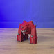 3D-printed Old School RuneScape TzTok-Jad minifigure shown being held and rotated by hand, with a detailed OSRS boss-inspired design.
