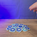 3D-printed Old School RuneScape teleport tablet keyring shown being held and rotated by hand, designed as an OSRS-inspired accessory for fans and players.