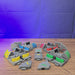 3D-printed Factorio interlocking conveyor belt pieces being assembled by hand, showing the modular belt design and colour options.