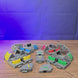 3D-printed Factorio interlocking conveyor belt pieces being assembled by hand, showing the modular belt design and colour options.