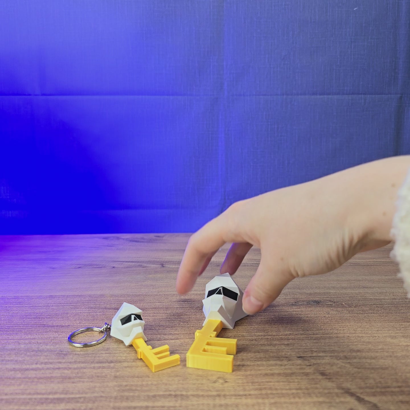 3D-printed Old School RuneScape loot key shown being held and rotated by hand, designed as a collectible OSRS display piece or gaming gift.