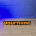3D-printed Factorio logo display sign with raised orange letters on a black base, shown from multiple angles.