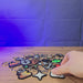 3D-printed Old School RuneScape skill keyrings shown being held and displayed, featuring multiple OSRS skill icon designs for fans and collectors.