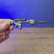 3D-printed SR25 DMR rifle keychain shown being held and rotated by hand, designed as a miniature rifle-inspired accessory or keyring.