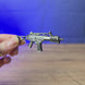 3D-printed HK G36 rifle keyring shown being held and rotated by hand, designed as a miniature rifle-inspired accessory or keychain.