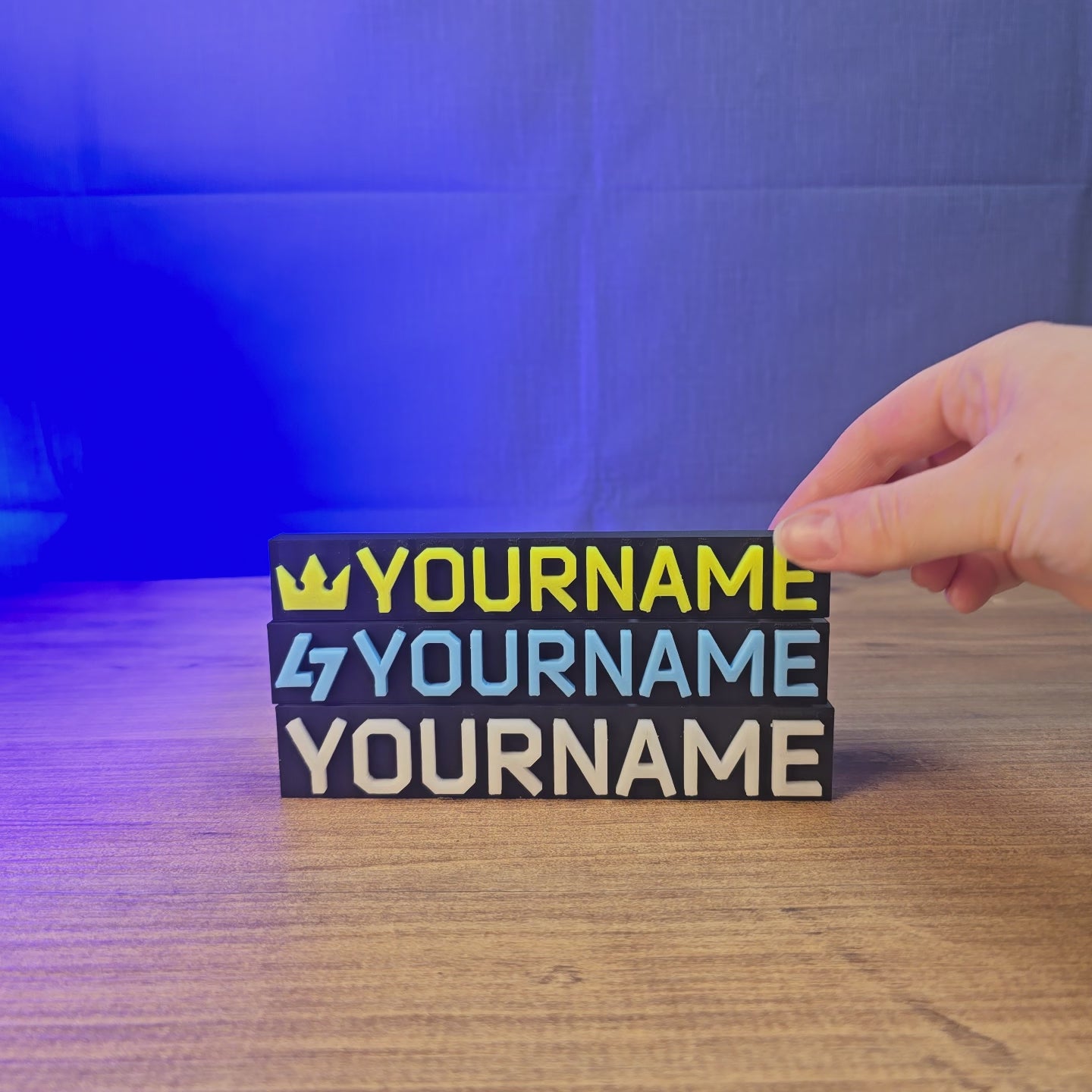 Glow-in-the-dark Escape from Tarkov-style nameplate shown being held and displayed, featuring custom Tarkov-inspired lettering for gaming desks, shelves, or display setups.