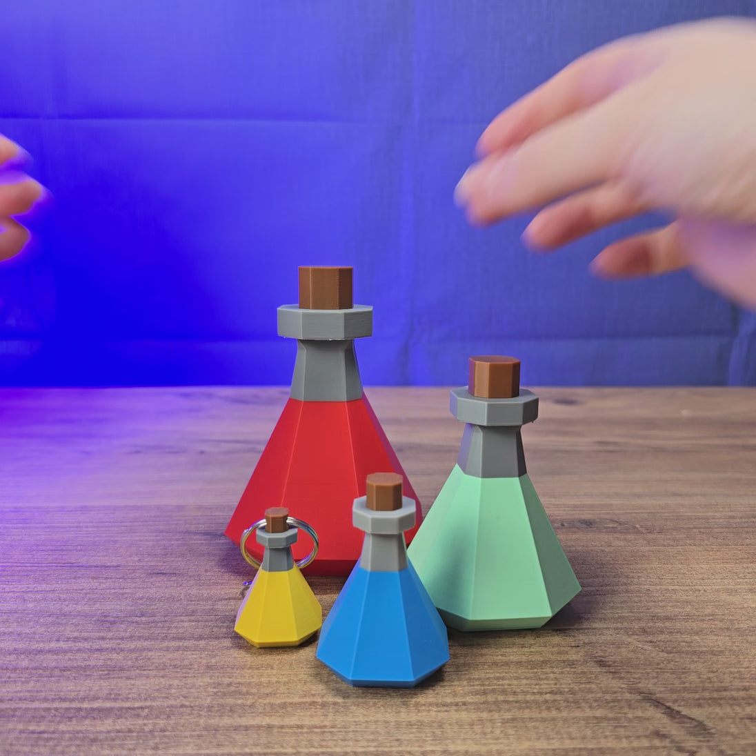 3D-printed RuneScape potion bottle with removable lid, shown being opened and rotated by hand as a game-inspired display piece or desk accessory.