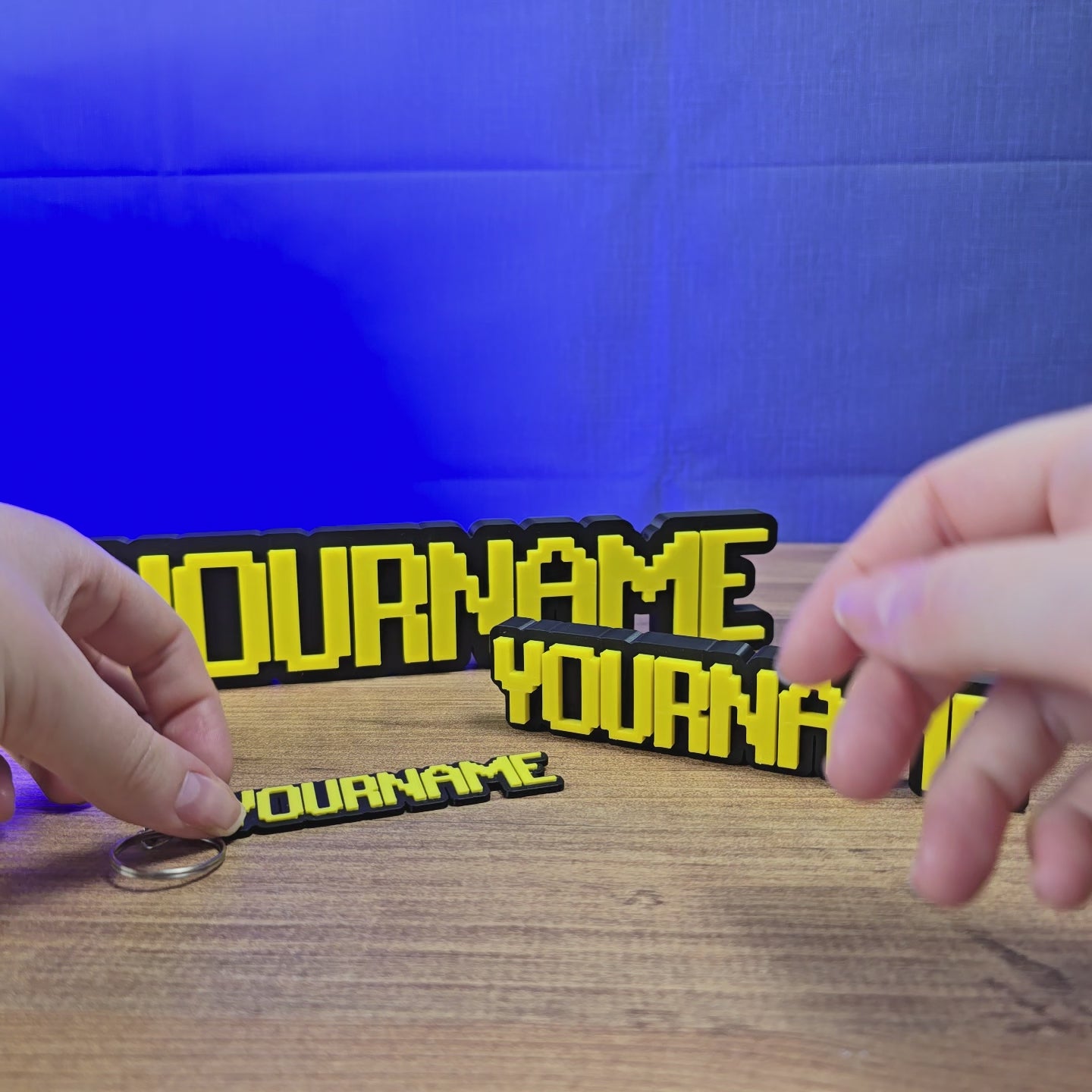 Personalised RuneScape-style custom nameplate shown being held and displayed, featuring OSRS-inspired lettering for gaming desks, shelves, or display setups.