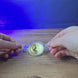 Physical Bitcoin replica inspired by Escape from Tarkov shown being held and rotated by hand, designed as a gaming display piece, collectible, or Tarkov fan gift.