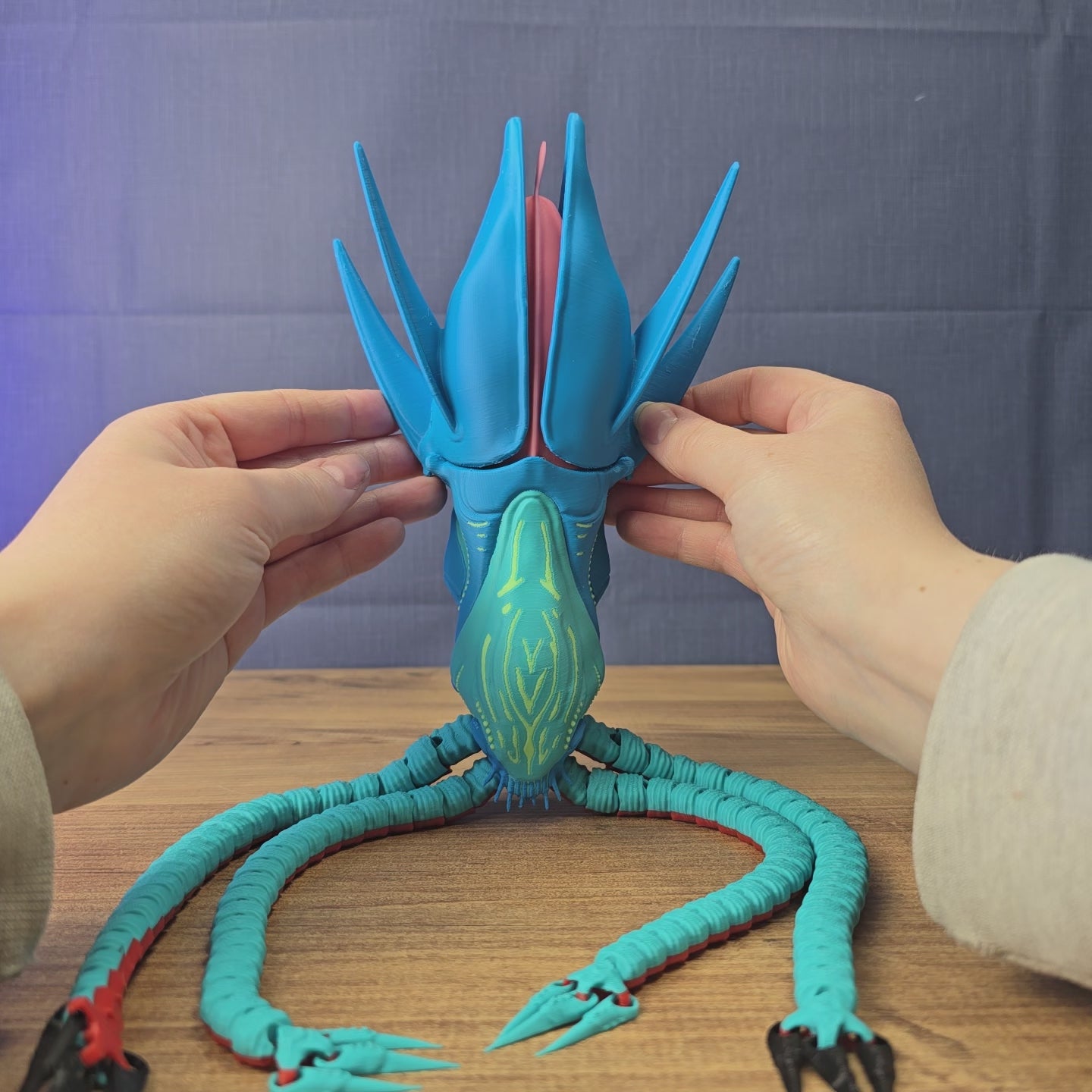Hands display a Collector Leviathan replica inspired by Subnautica 2, showing the squid-like creature design with tentacles from multiple angles.