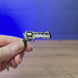 Chiappa Rhino mini revolver keyring shown being held and rotated by hand, designed as a miniature revolver-inspired accessory or keychain.