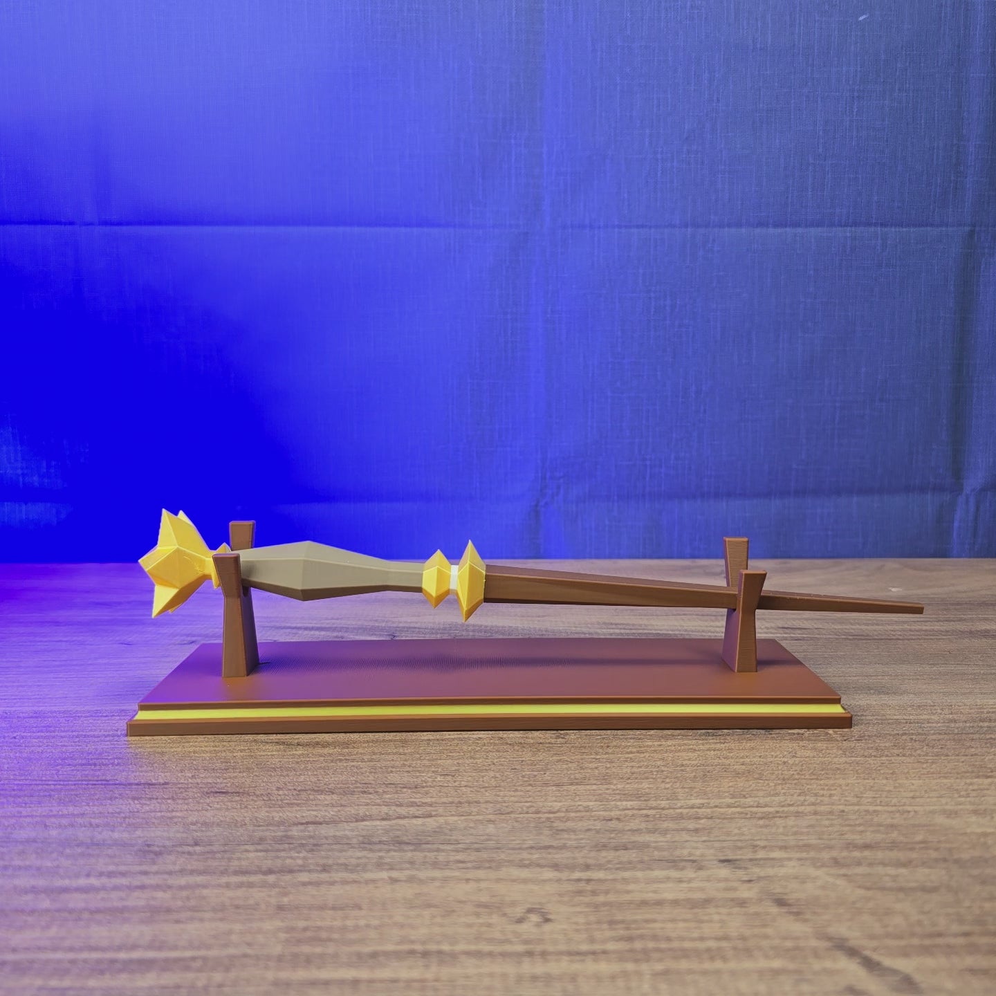 3D-printed RuneScape Master Wand replica shown being held and displayed with an optional stand and custom nameplate for OSRS fans.
