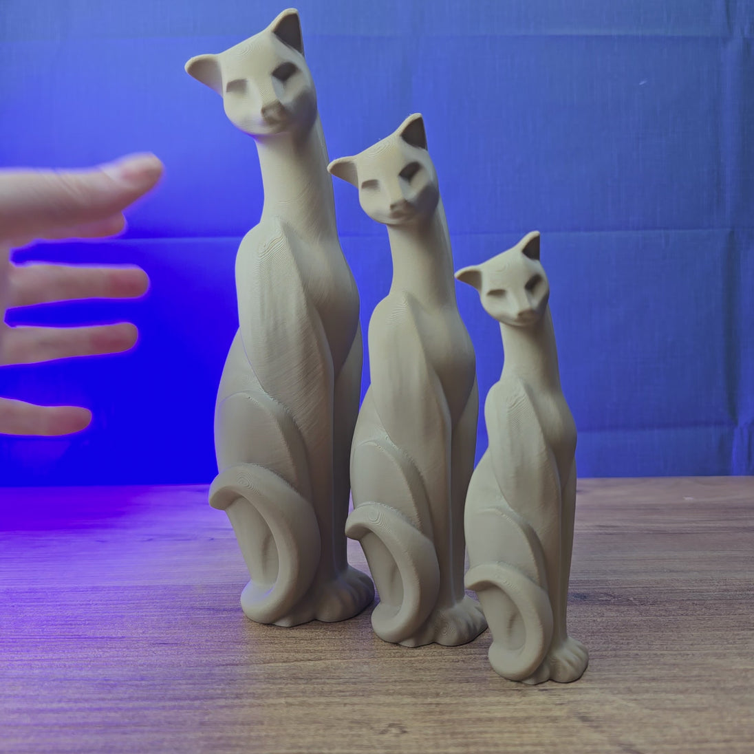 Cat figurine replica inspired by Escape from Tarkov shown being held and rotated by hand, designed as a gaming display piece, collectible, or Tarkov fan gift.