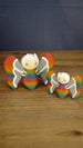 Large 12 cm and small 8 cm Rainbow-Tipped Butterfly Plush figures inspired by Palia, shown together with rainbow bodies and detailed grey wings.