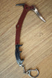 Red Rebel ice pick keyring replica shown from above with red handle, black grip, silver pick head, and compact keychain attachment.