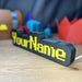   Side View of RuneScape Font Nameplate with Yellow Text and LED Lighting