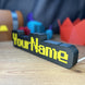   Side View of RuneScape Font Nameplate with Yellow Text and LED Lighting