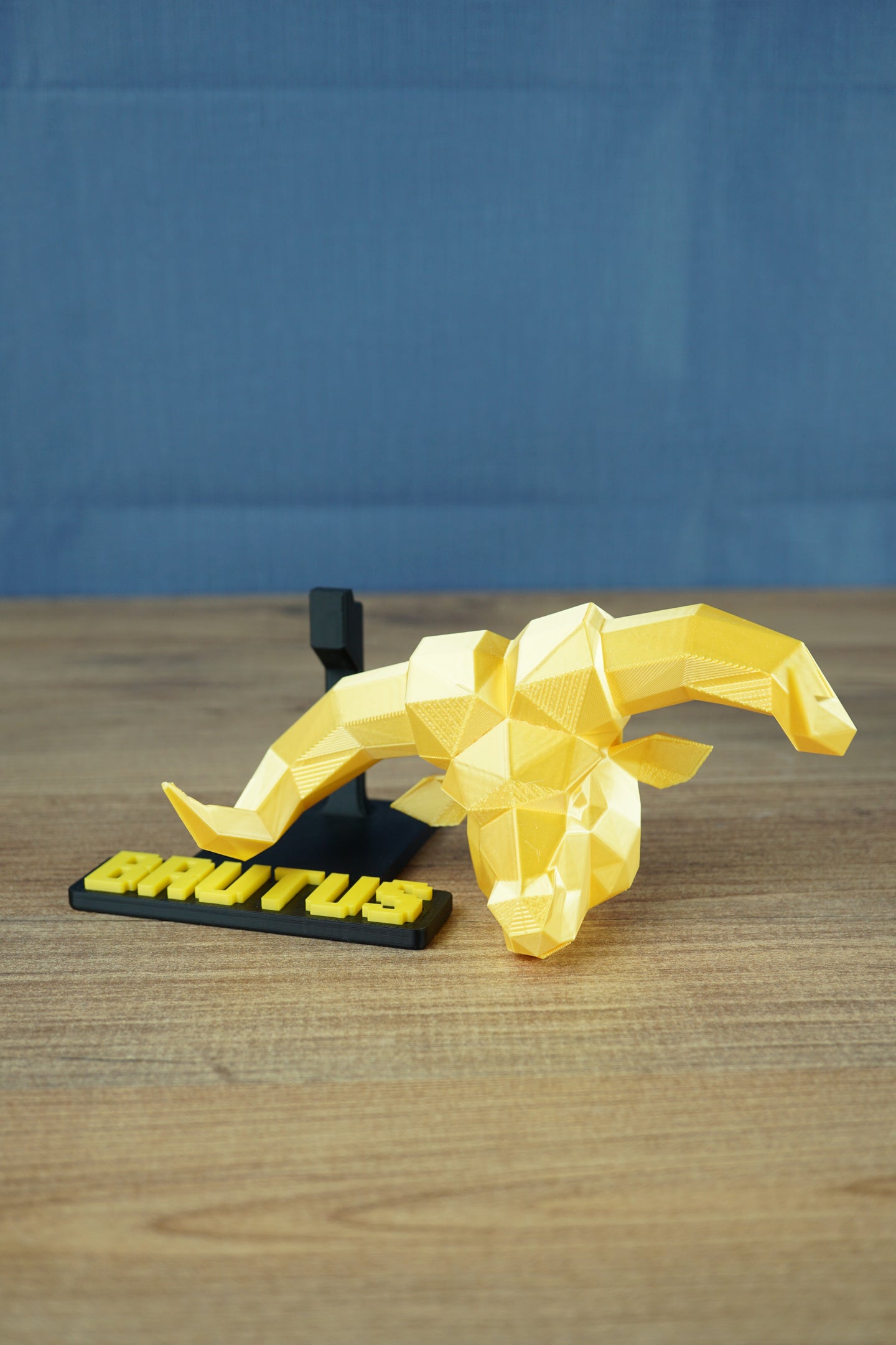 RuneScape Brutus statue head gold angled view premium collectible