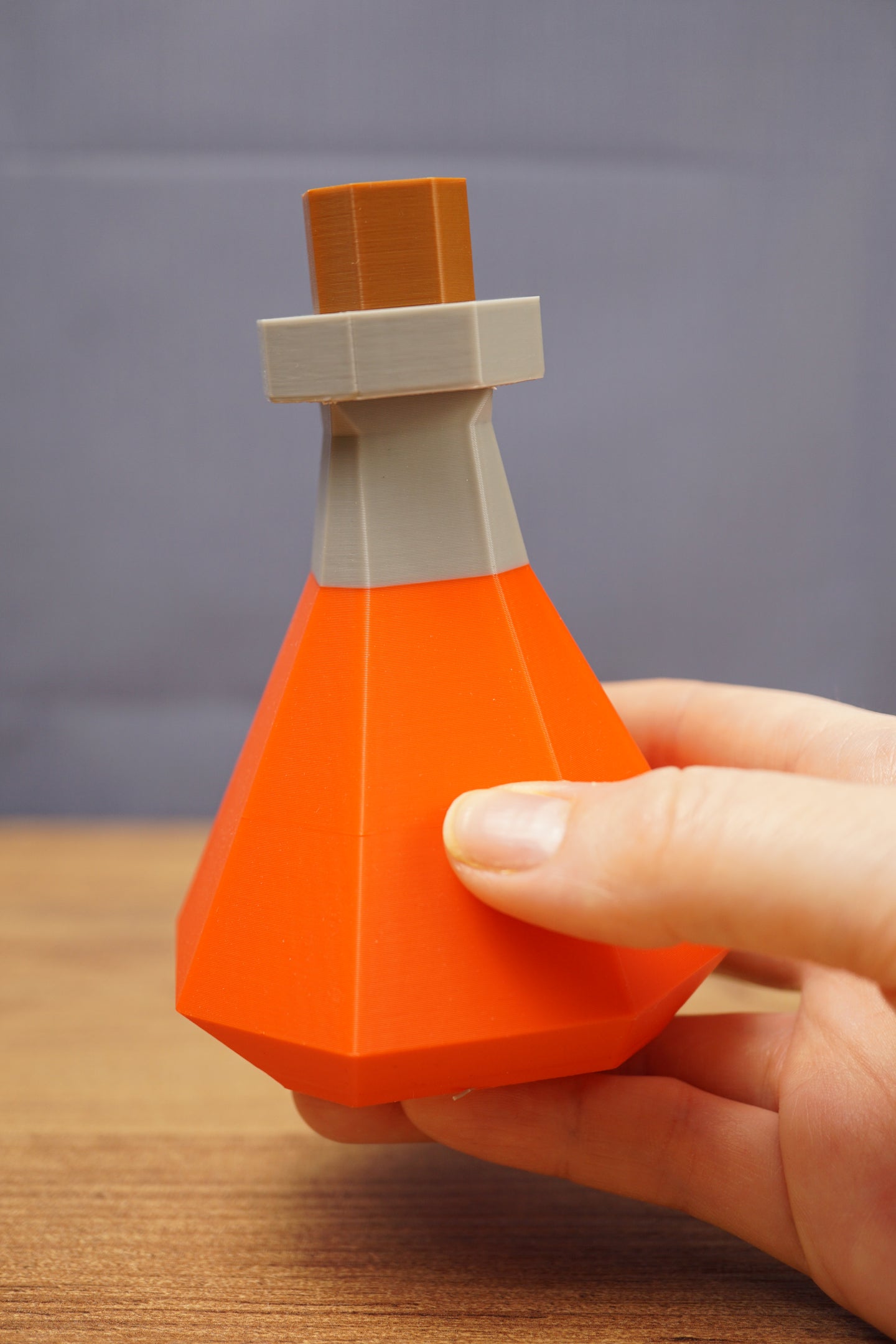 RuneScape potion bottle shown in hand size comparison OSRS prop