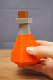 RuneScape potion bottle shown in hand size comparison OSRS prop