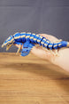 Full side view of the Shiver Leviathan figure held in hand, showing its 26cm length, articulated body, fins, and tail.