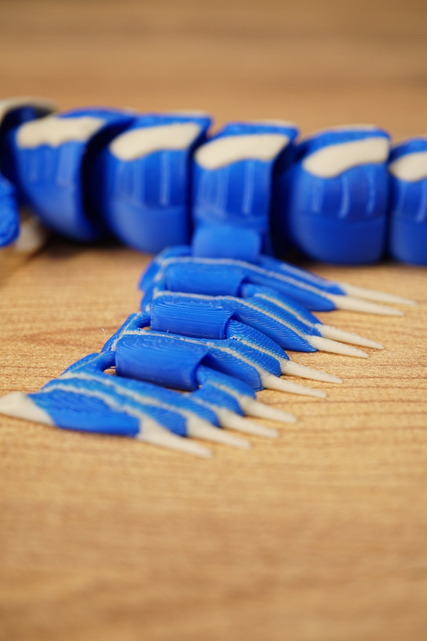 Detailed close-up of the Shiver Leviathan fin section with blue articulated panels, bone spikes, and segmented body behind.