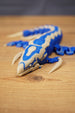 Front angled view of the Shiver Leviathan figure with open jaw, curved claw, blue body, and bone colour markings.