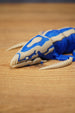 Close-up of the Shiver Leviathan head and front claws, showing bone colour jaw details, blue markings, and creature styling.