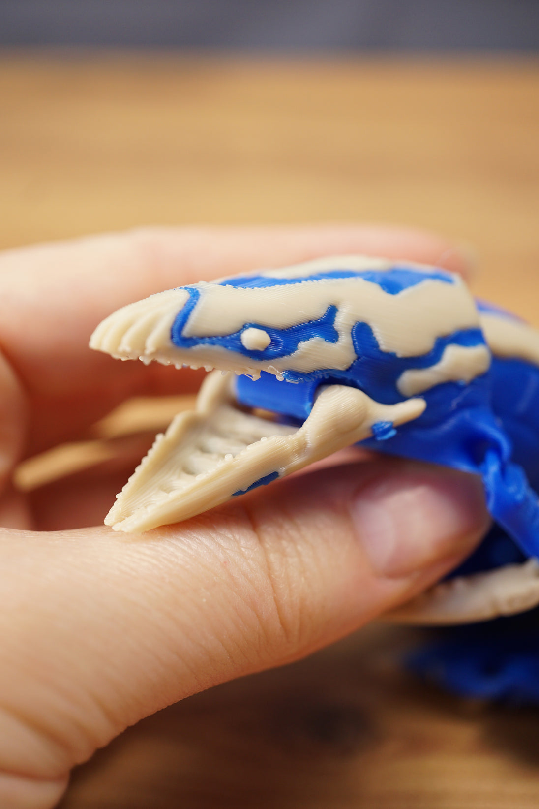 Macro close-up of the Shiver Leviathan head with open jaw, sharp teeth, bone colour face details, and blue markings.