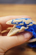 Macro close-up of the Shiver Leviathan head with open jaw, sharp teeth, bone colour face details, and blue markings.