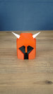 Front view of the small Dragon Med Helm collectible replica with classic red, black and white colours for RuneScape fans