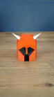 Front view of the small Dragon Med Helm collectible replica with classic red, black and white colours for RuneScape fans
