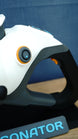 Close-up of Subnautica 2 Sonic Resonator replica rear grip showing circular orange and cyan detailing, dark grey frame and ergonomic handle