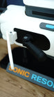 Detailed close-up of Sonic Resonator replica side compartment with hinged white panel, internal control assembly and cyan accent from Subnautica 2