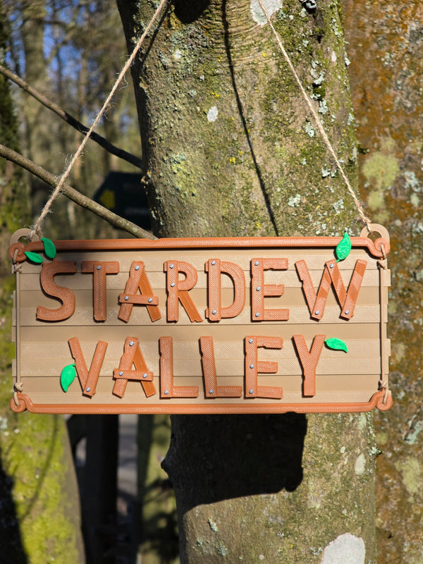 stardew valley sign hanging on tree outdoor