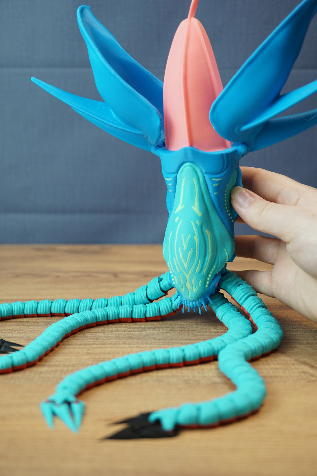 Large Collector Leviathan fan figure with hand for size comparison, blue fins, coral head crest, and poseable tentacles