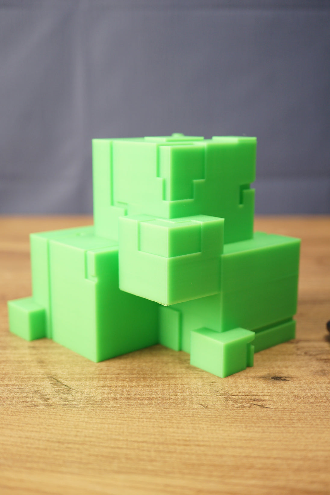 Subnautica ion cube replica shown from the front with bright green cube design, stepped block details, and sci-fi collectible styling.