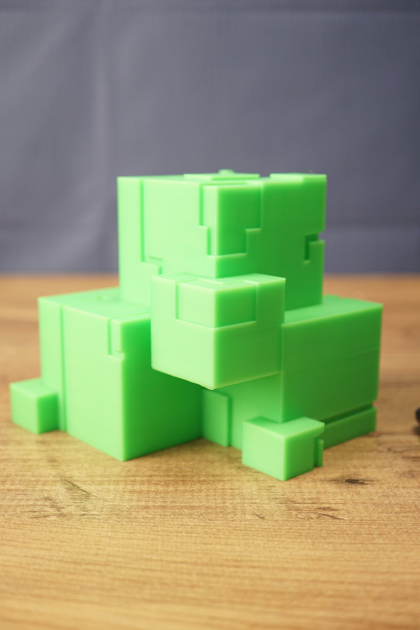 Subnautica ion cube replica shown from the front with bright green cube design, stepped block details, and sci-fi collectible styling.