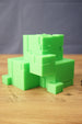 Subnautica ion cube replica shown from the front with bright green cube design, stepped block details, and sci-fi collectible styling.
