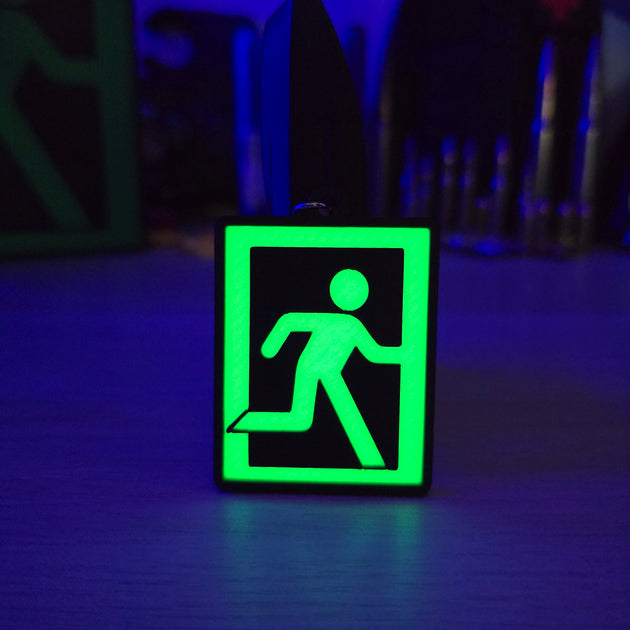 Glowing Effect of Tarkov Extraction Symbol Keyring in Dark


