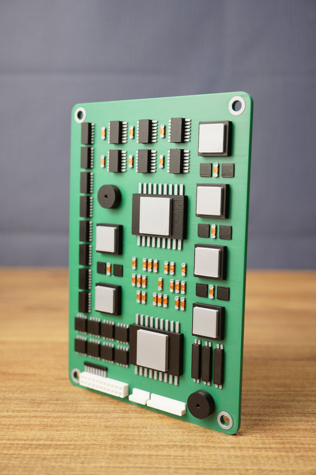Angled view of a Tarkov inspired military circuit board replica, highlighting layered black chips, silver modules, white ports, and green board detail.