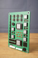 Angled view of a Tarkov inspired military circuit board replica, highlighting layered black chips, silver modules, white ports, and green board detail.