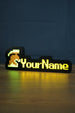 Illuminated unranked group ironman nameplate glowing in the dark with green and grey helmet icon and bright yellow personalized text.
