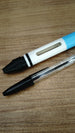 WARDOGS Adrenaline Pen replica alongside a transparent BIC ballpoint pen, showing the gaming-inspired casing and compatible writing pen style.