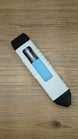 WARDOGS Adrenaline Pen replica lying on a wooden table, featuring a white ribbed casing, black end caps, blue panel and silver clicker mechanism.